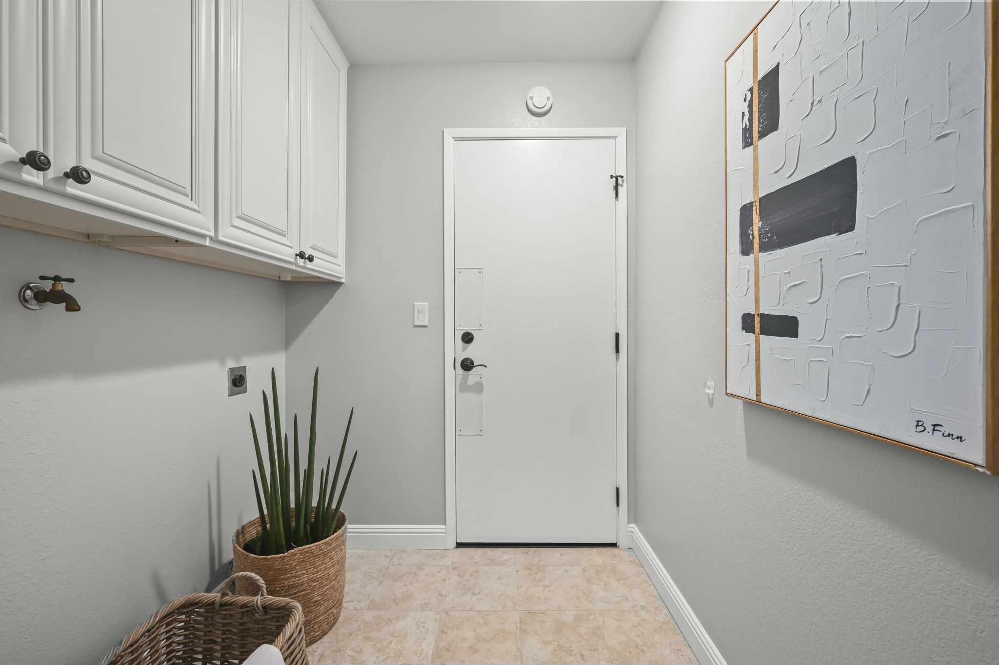 Separate laundry room with direct garage access