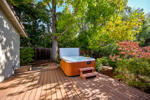 Unwind in the hot tub just off the primary bedroom