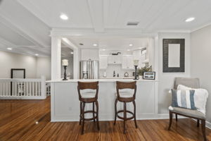 Bar stools facing kitchen