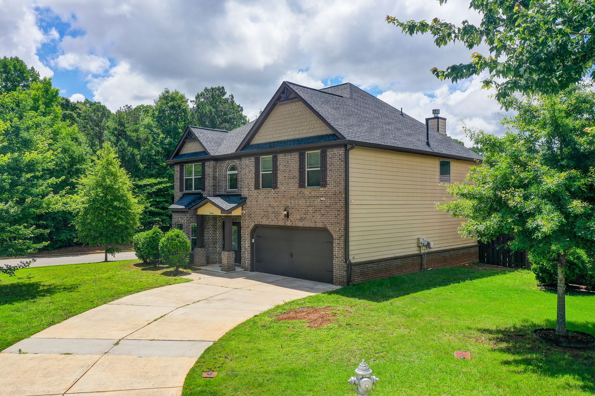 40 Aerial Ext Front + Side w Driveway