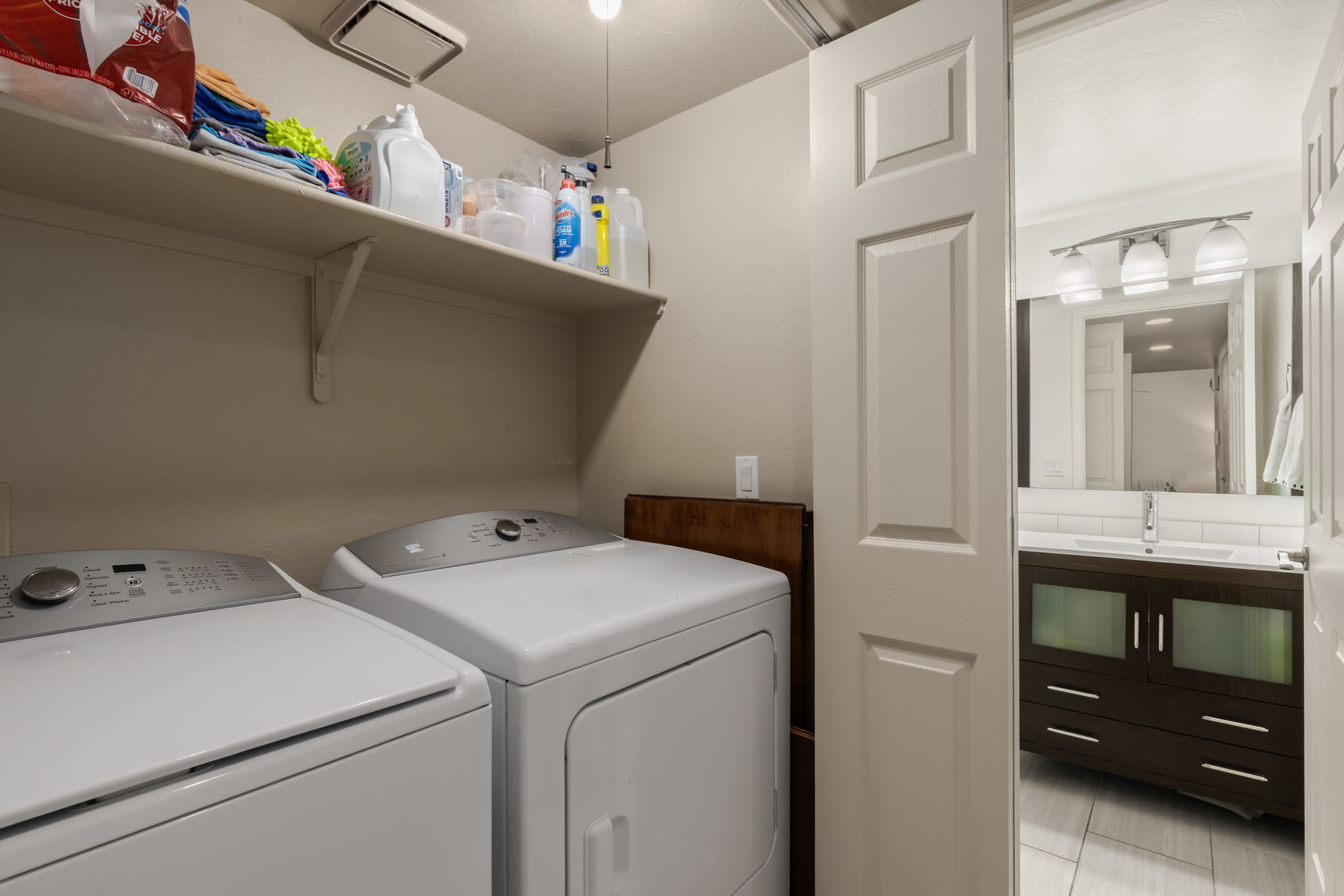 Laundry Closet and view to half bath