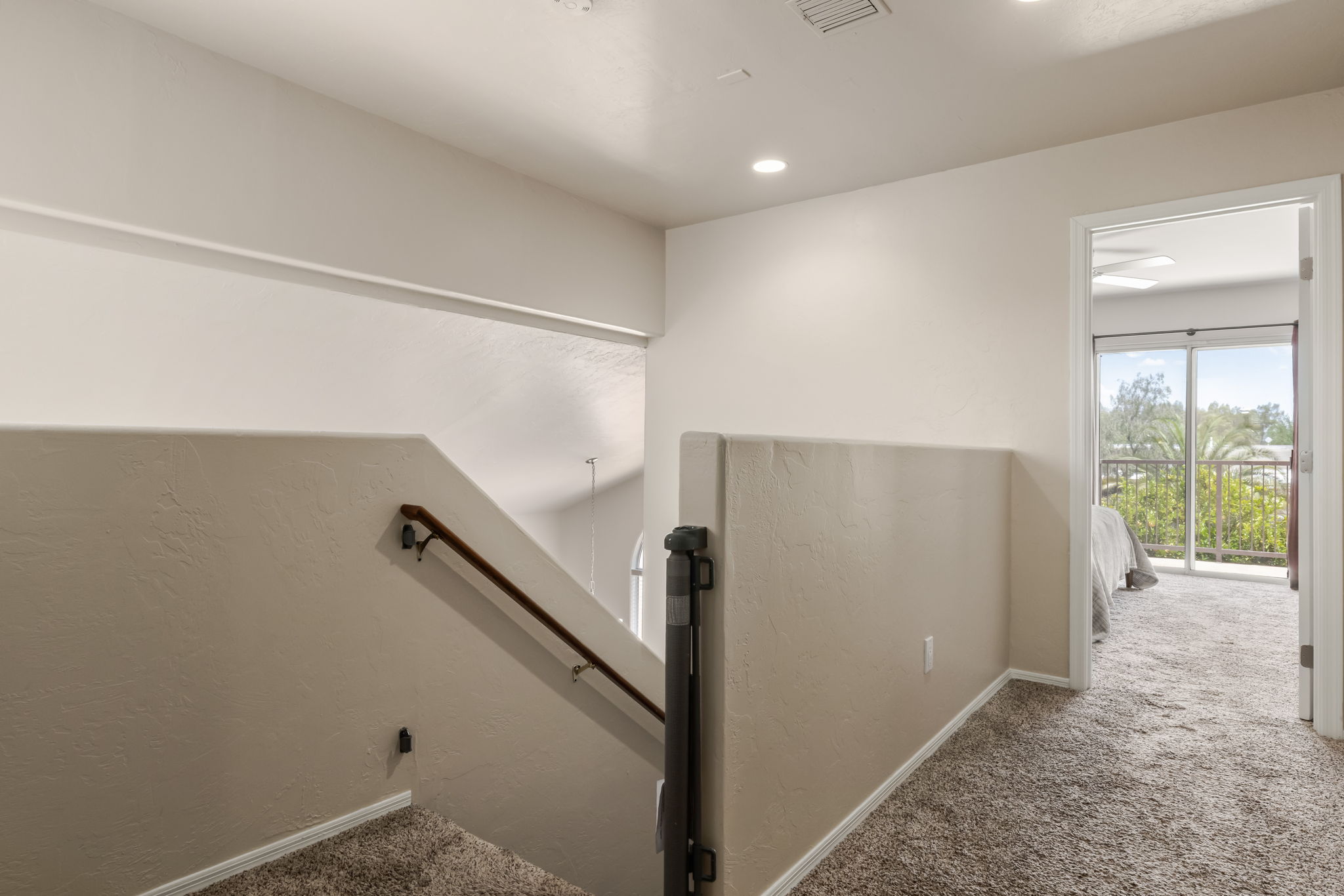 Stairwell landing, view to Primary Bedroom