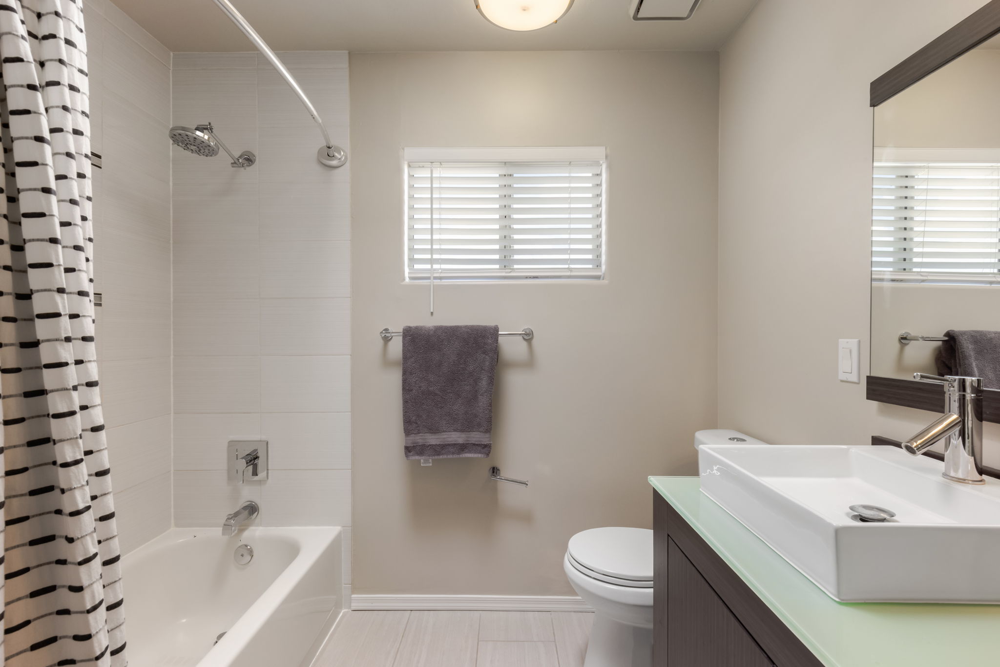 Primary Bathroom with tiled tub shower