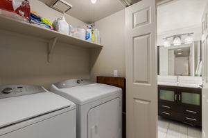 Laundry Closet and view to half bath