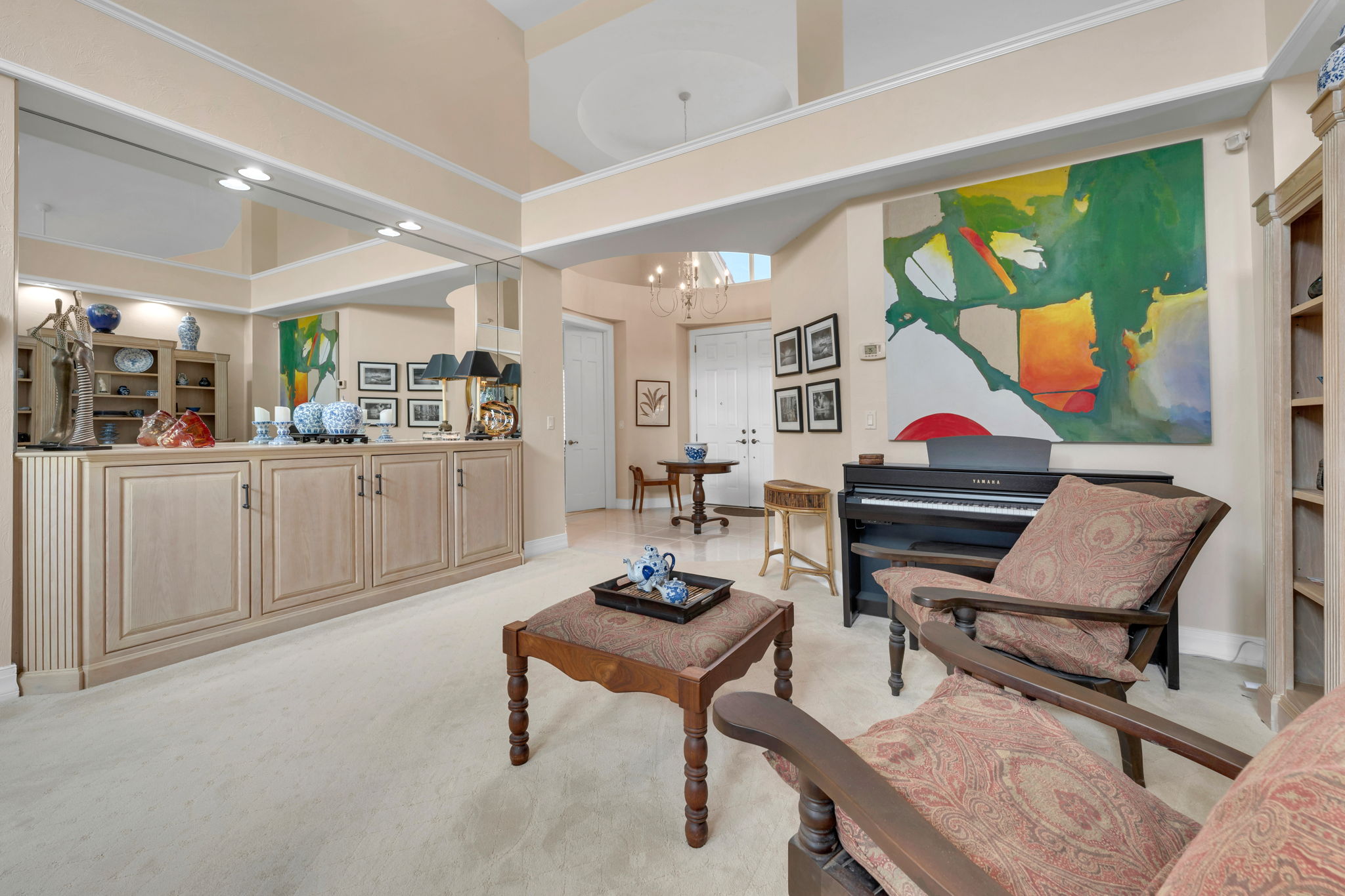 Rotunda Entry, Volume Ceilings, and expansive sitting, great room awaits.