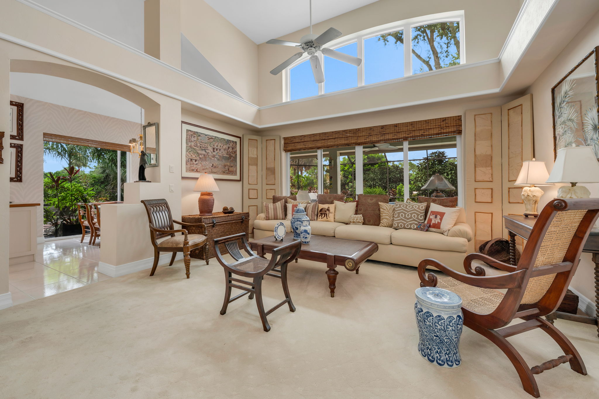 Great room with large impact window above sliders