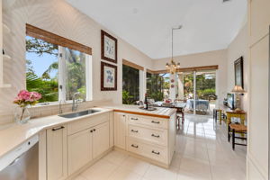 Updated kitchen with glass surround. Windows, seamless glass, and sliders to bring the outdoors in
