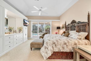 Primary Bedroom with built-in storage plus a walk-in closet outside of bathroom