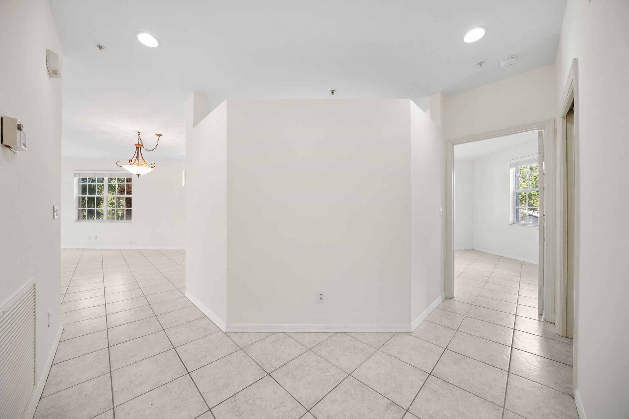 Generous Foyer with Laundry /Utilities to Left | Coat Closet to Right