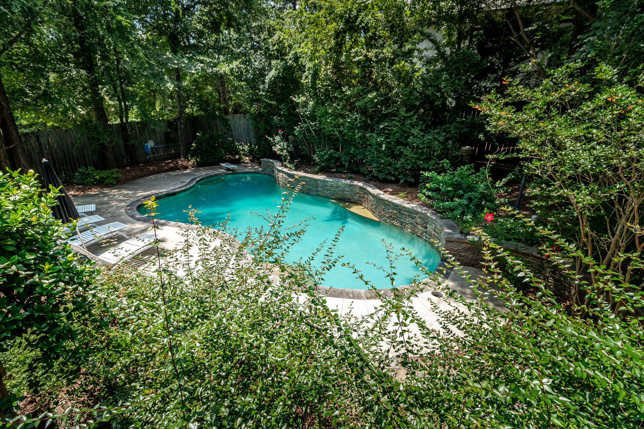View Of Pool From Upper Back Deck