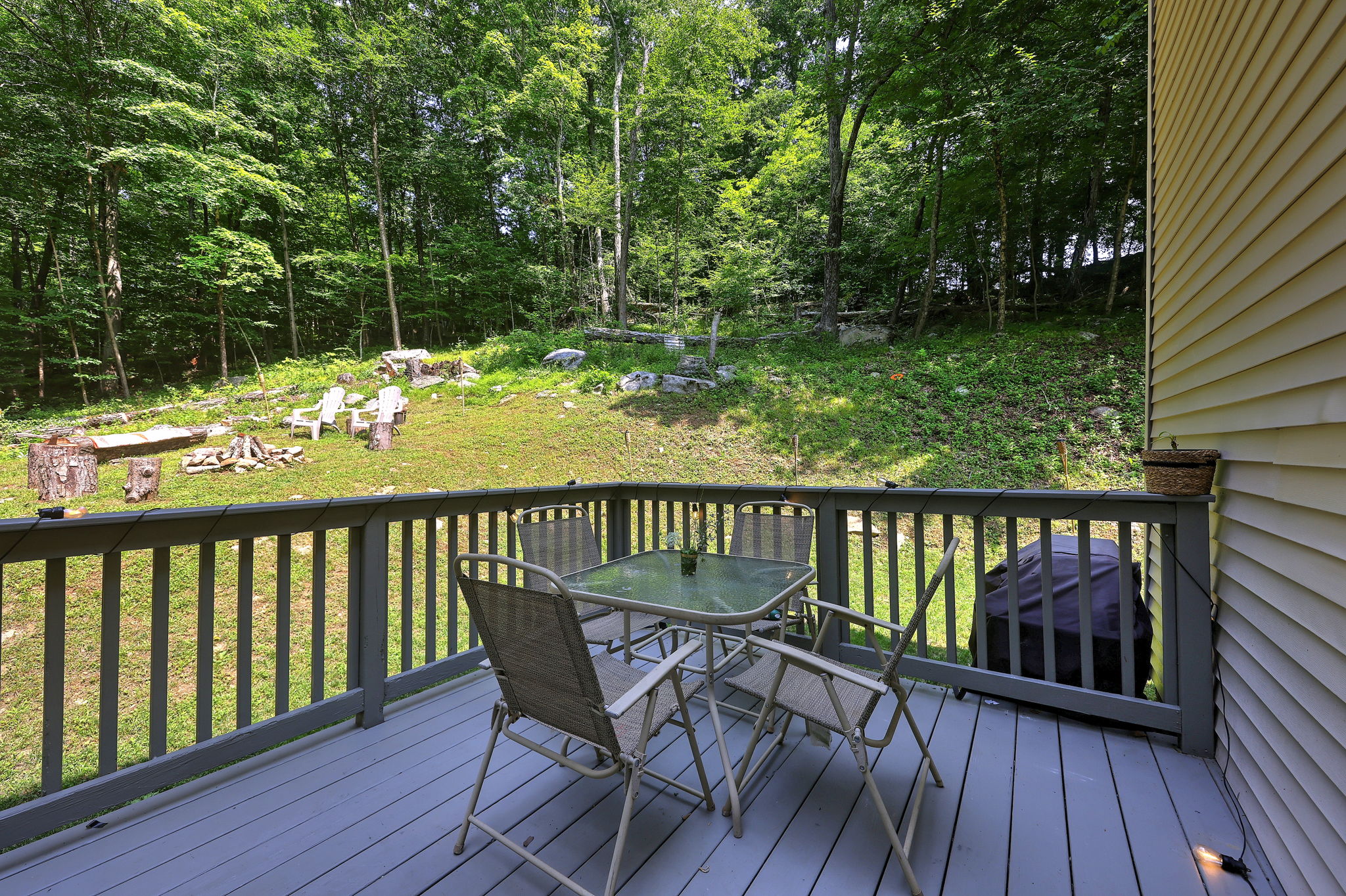 Enjoy outdoor dining, morning coffee, or simply relax as you take in the peaceful wooded surroundings.