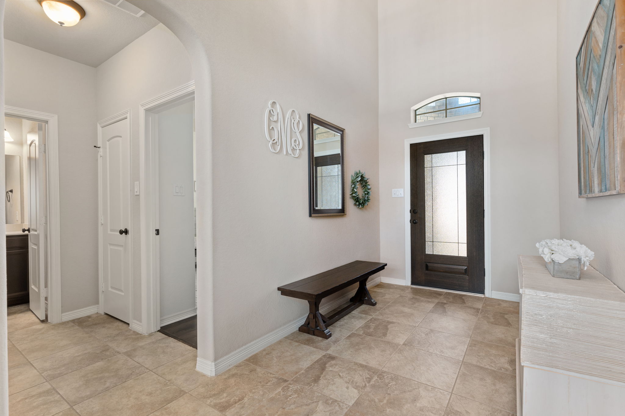 Welcoming entry way with guest bedroom to the right.