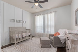 Guest bedroom with updated flooring and wall accents!
