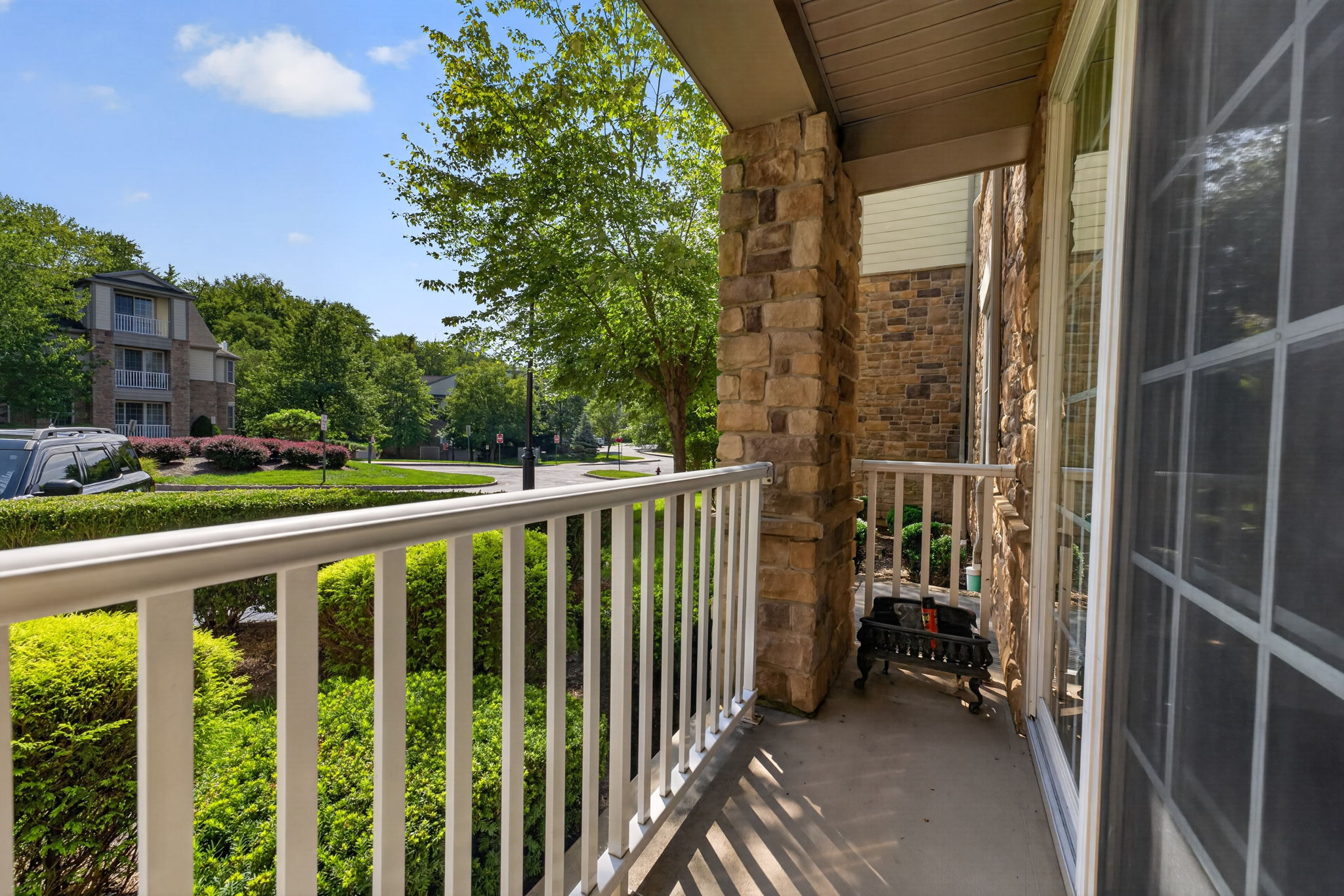 A slider from the living room opens to a charming patio, creating an ideal spot to relax or enjoy your morning coffee.