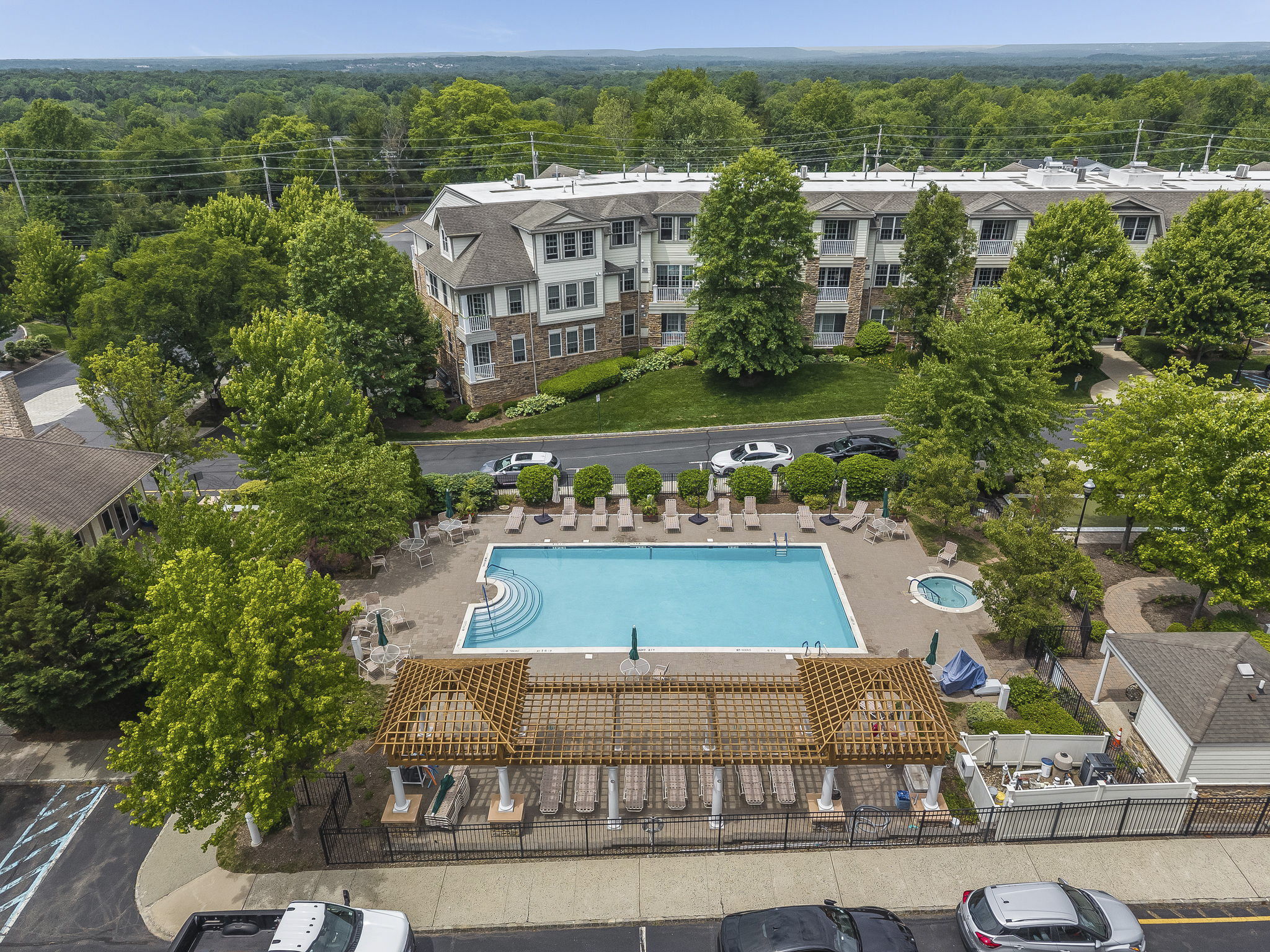 Aerial View-The meticulously maintained grounds, with colorful Zen-like gardens and a tranquil waterfall fountain creates a peaceful setting for relaxation and socializing.