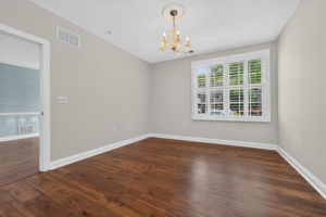The primary suite is freshly painted and offers a walk-in closet + a double slider closet, and a beautifully appointed en-suite bath. Other features include a candlelight chandelier, plantation shutters, and LVT flooring.