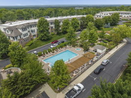 Aerial View-The meticulously maintained grounds, with colorful Zen-like gardens and a tranquil waterfall fountain creates a peaceful setting for relaxation and socializing.