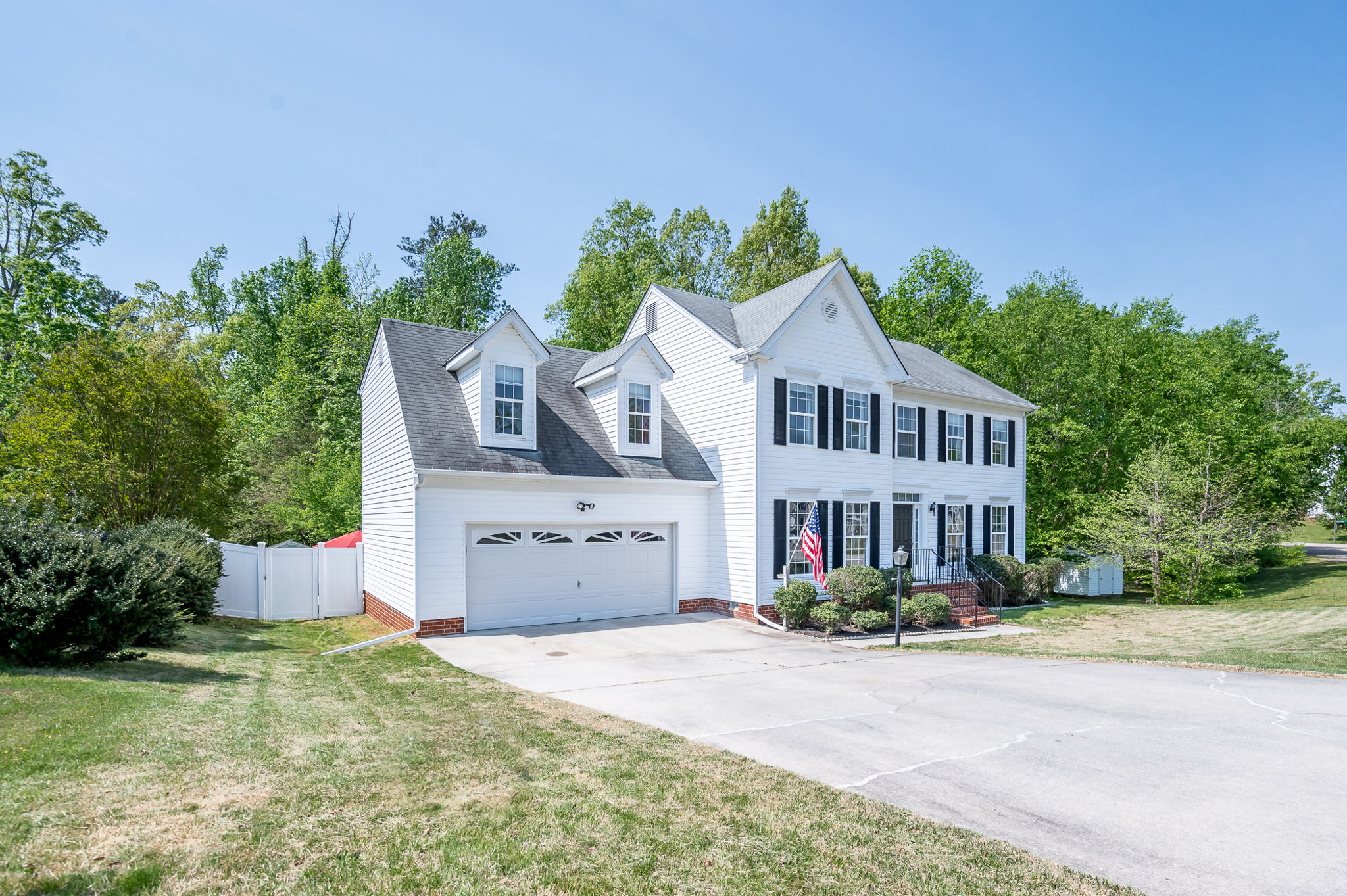 4 BEDROOM & 2 1/2 BATHROOM VINYL SIDED HOME WITH AN INCREDIBLY PRIVATE