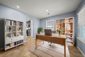 The perfect space for an at home office! Tile flooring, 2" blinds, recessed lighting and arched entryways leading to the kitchen & living area! *virtually staged*