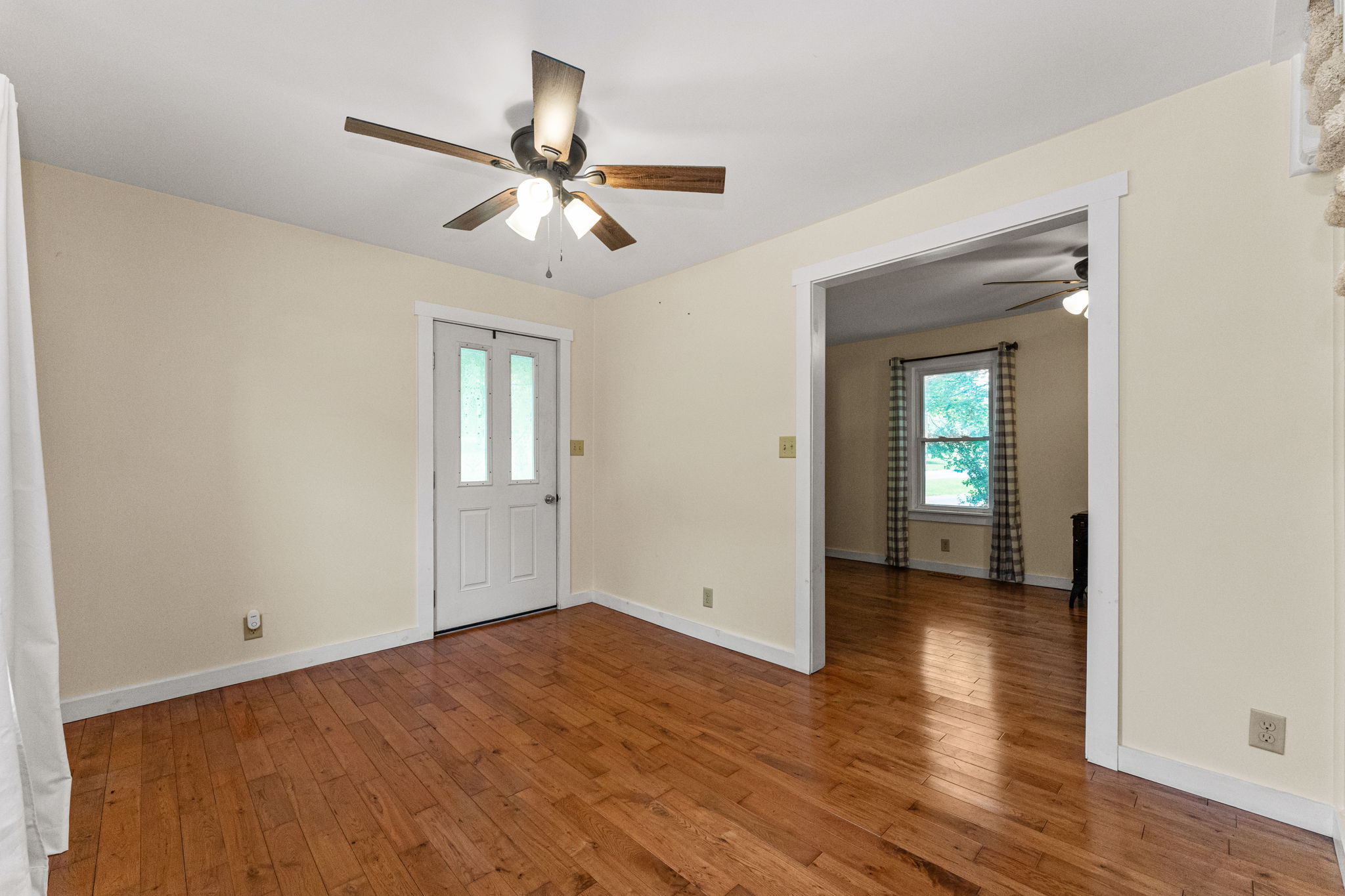 Large Foyer with Hardwood Flooring