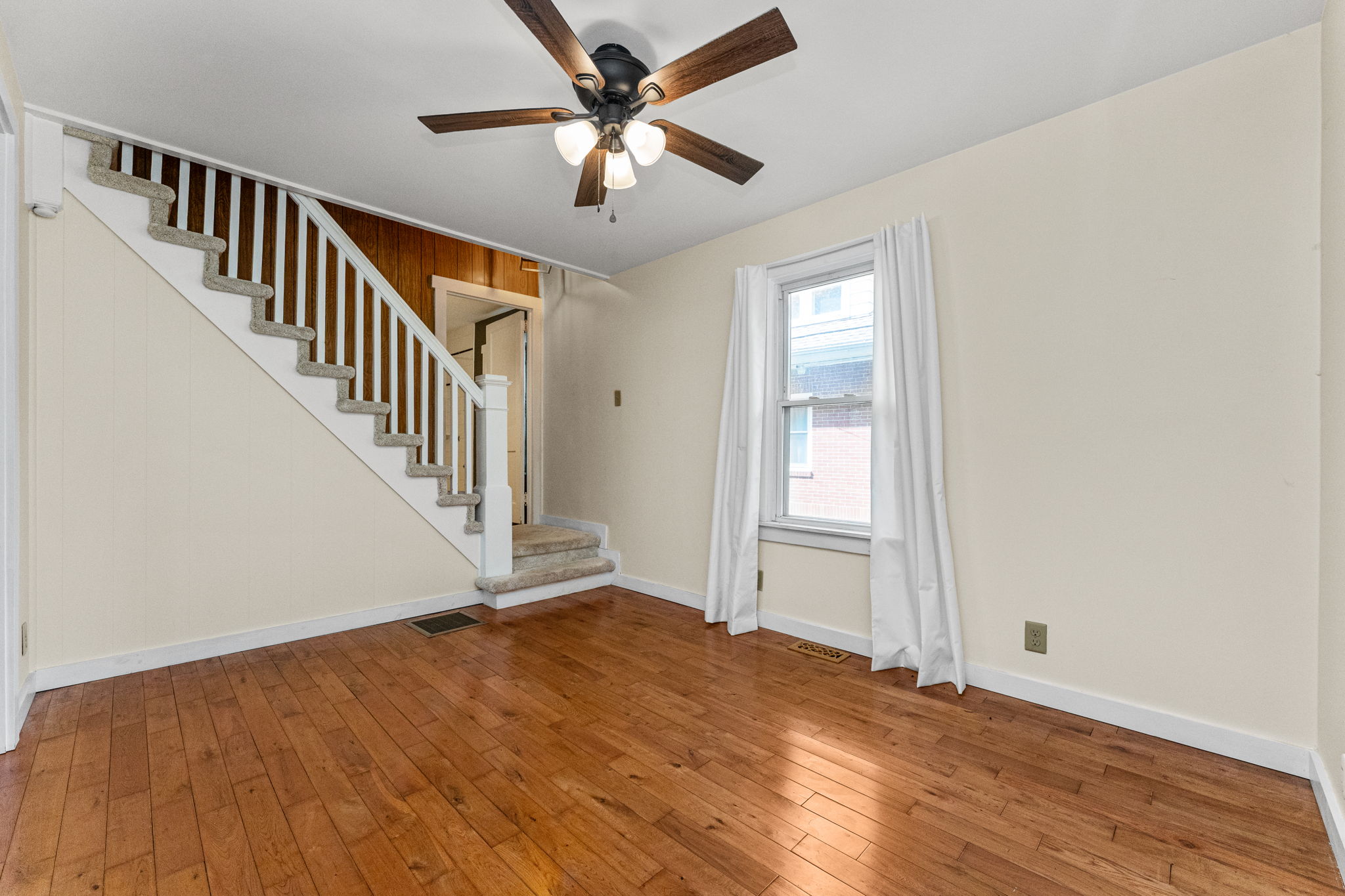 Large Foyer with Hardwood Flooring