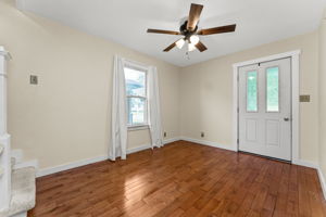 Large Foyer with Hardwood Flooring