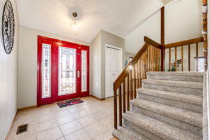 Elegant Entrance w Tile Landing & Soaring Vaults