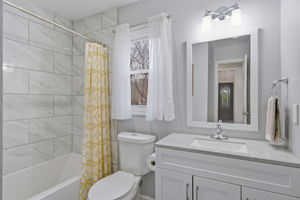 Situated on OVER HALF an ACRE of Private Wooded Land!