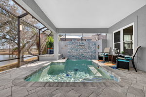 Swimming Pool with Privacy Wall and Three Waterfalls