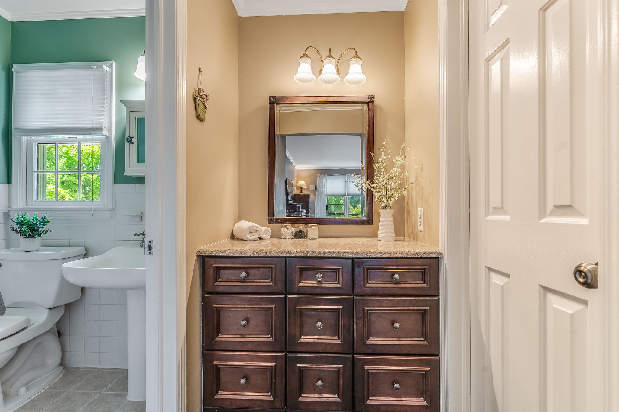 Medicine cabinet with mirror, pedestal sink, shower with insert, ceramic tile floor