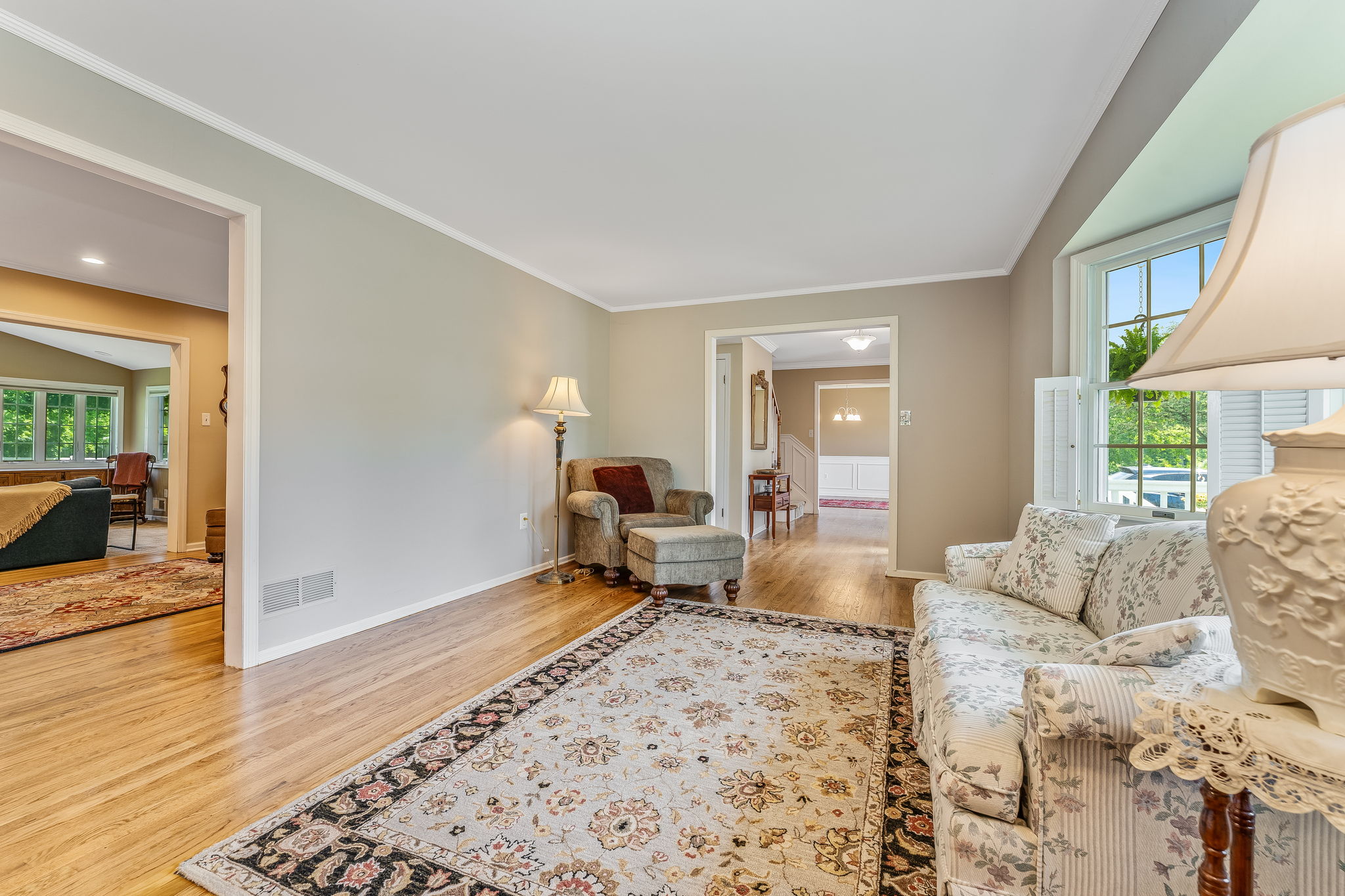 Recessed lighting, crown moulding, built-in cabinetry, bay windows, shutters, hardwood floor