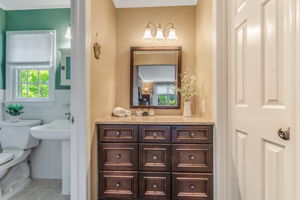 Medicine cabinet with mirror, pedestal sink, shower with insert, ceramic tile floor