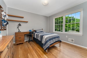 Bedroom 4 Double door closet and hardwood floor