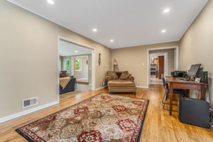 Game Room/Den-A versatile room provides the perfect space for home office/den or recreation room. Features include crown moulding, recessed lighting, hardwood floor.
