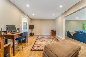 Game Room/Den-A versatile room provides the perfect space for home office/den or recreation room. Features include crown moulding, recessed lighting, hardwood floor.