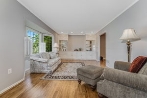 Recessed lighting, crown moulding, built-in cabinetry, bay windows, shutters, hardwood floor