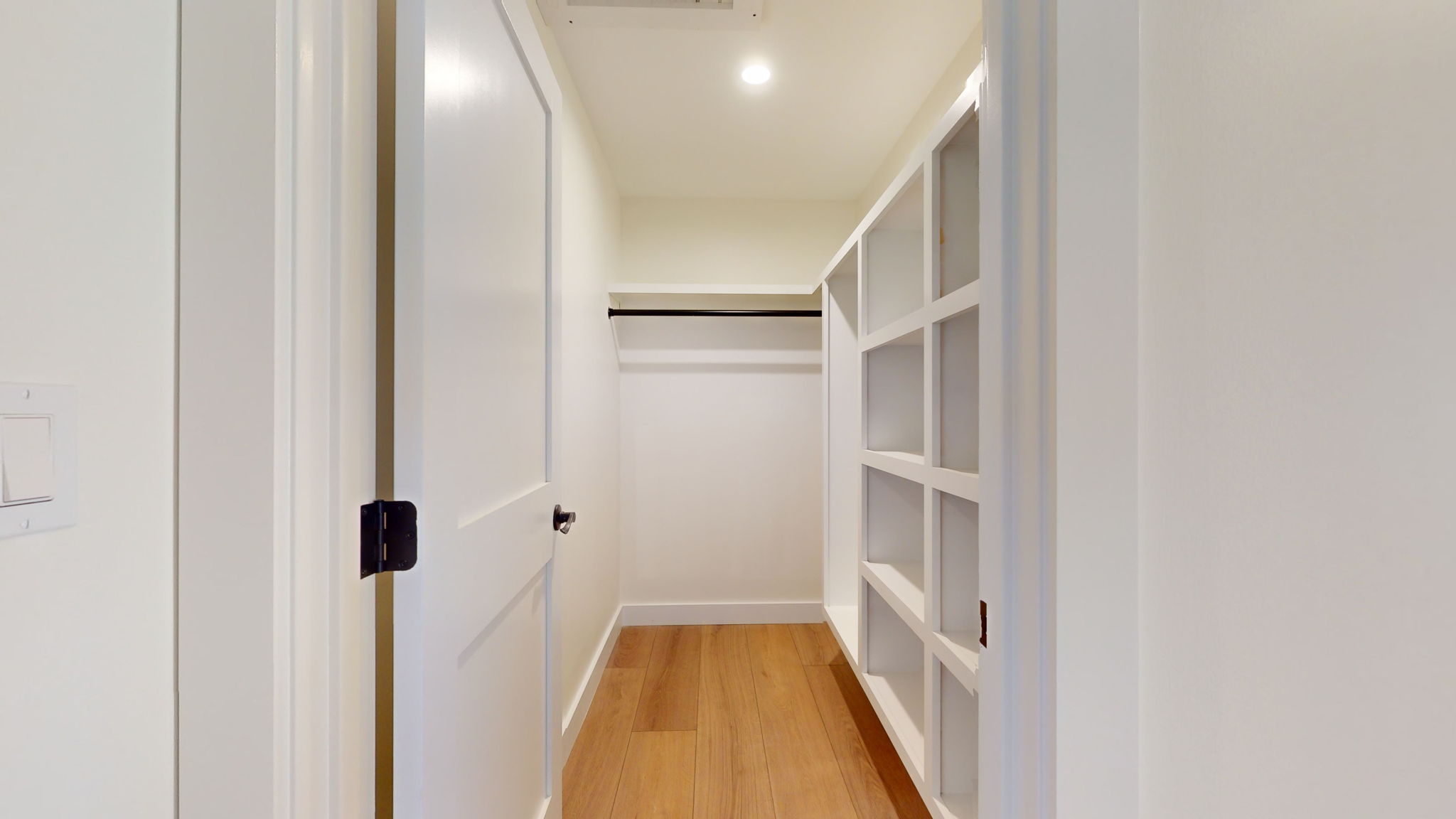 Primary bedroom walk-in closet