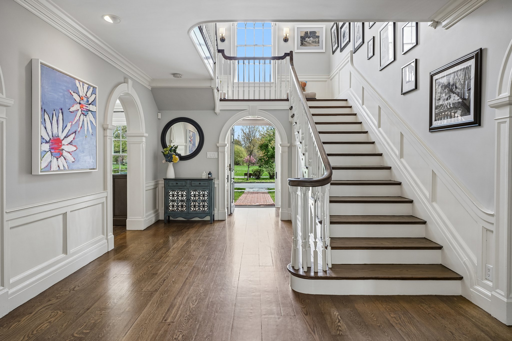 A grand entrance in every sense - sweeping staircase, exquisite millwork, and the kind of arrival moment that never gets old.
