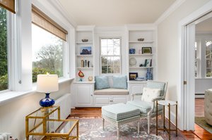 Sunroom with Built Ins and Large Windows