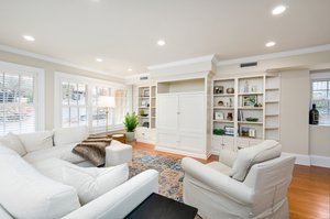 Family Room Includes Built Ins and Large Windows