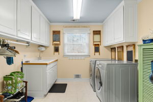 Laundry Rm w/Pantry, Linen Press Cabinet, Built-in Ironing Board