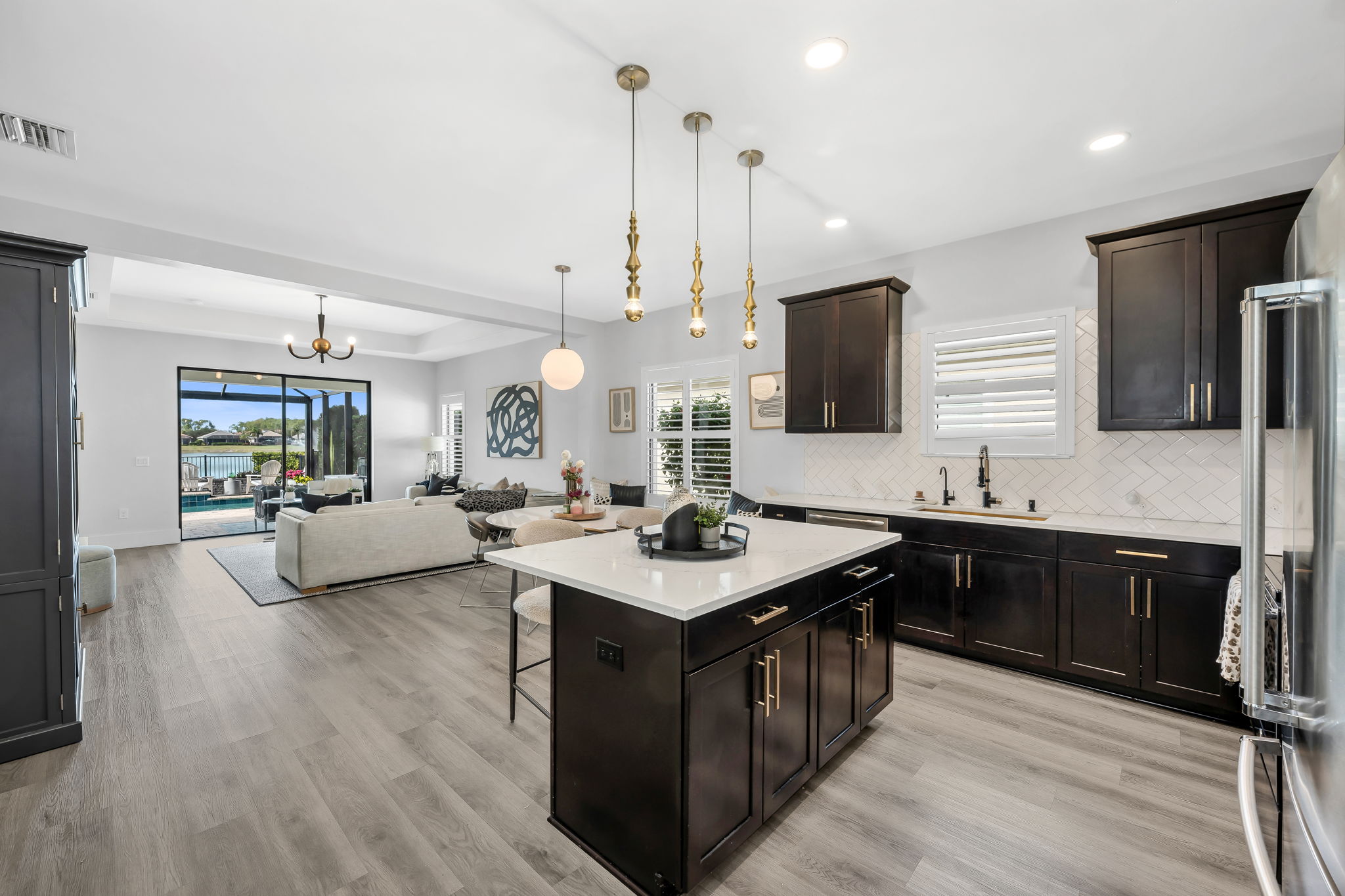 Kitchen Featuring an Island, Open to The Dining Area and Living Room