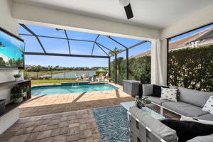 Swimming Pool with Picture Window Screen and Sitting Area. Featuring a Long Lake Western View