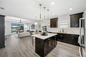 Kitchen Featuring an Island, Open to The Dining Area and Living Room