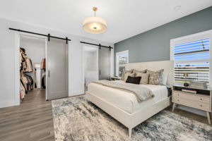 Primary Bedroom with Walk-In Closet and Barn Doors