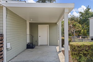 This is the everyday route home: park under cover, carry the groceries a few steps, and enter directly beside the kitchen.