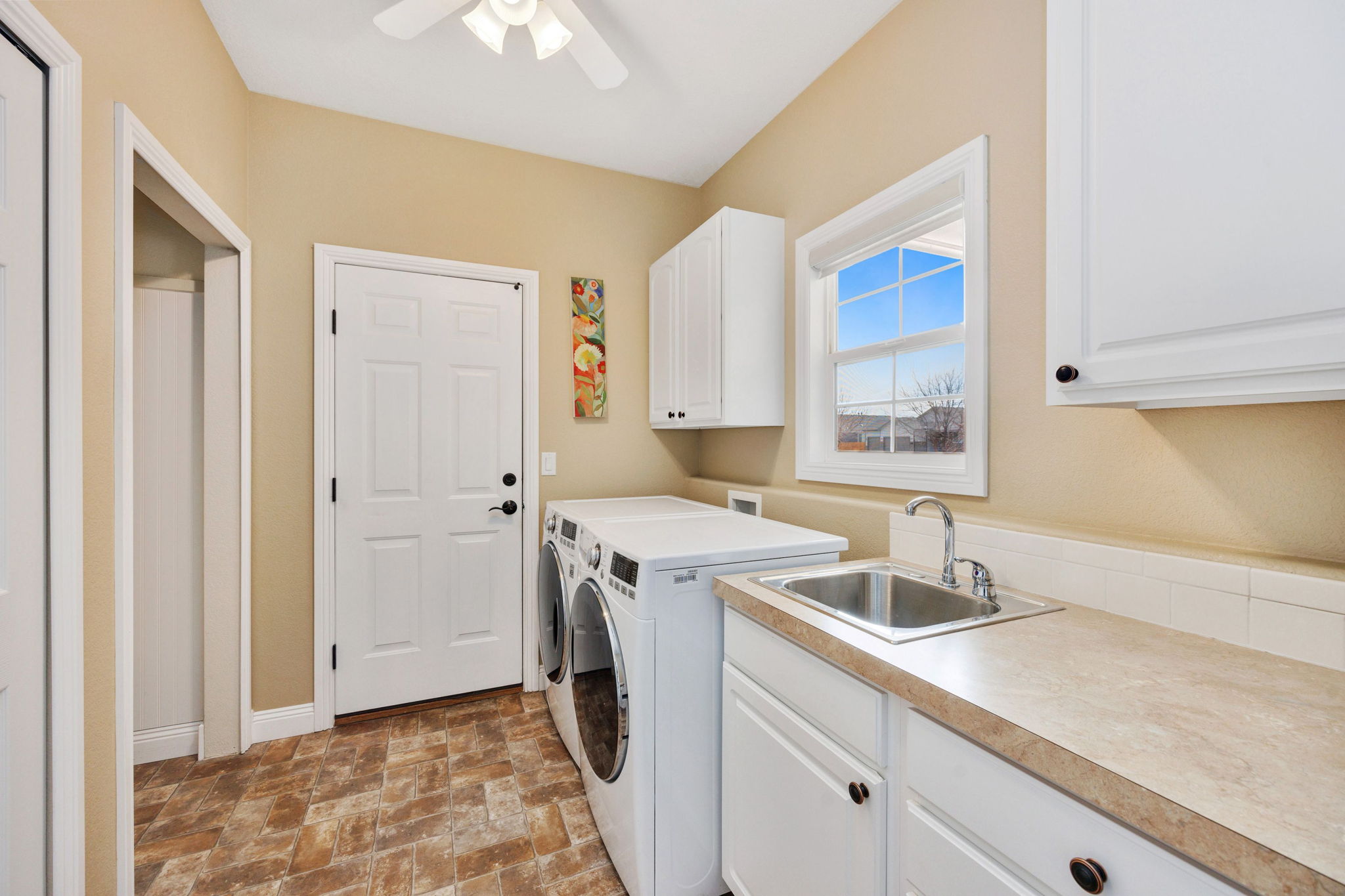 Laundry and mudroom with access to over-sized 3 car garage