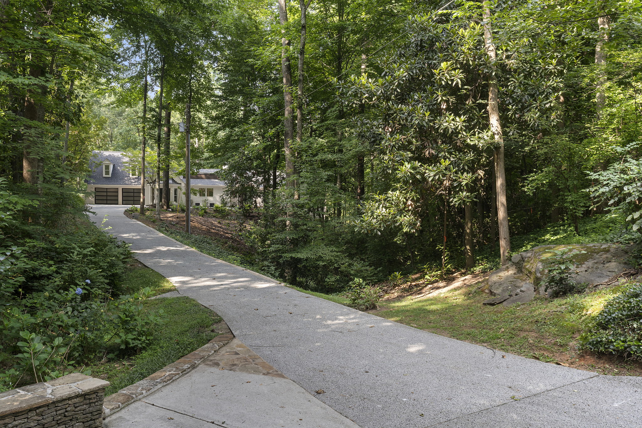 Behind the gates is a long driveway to the property