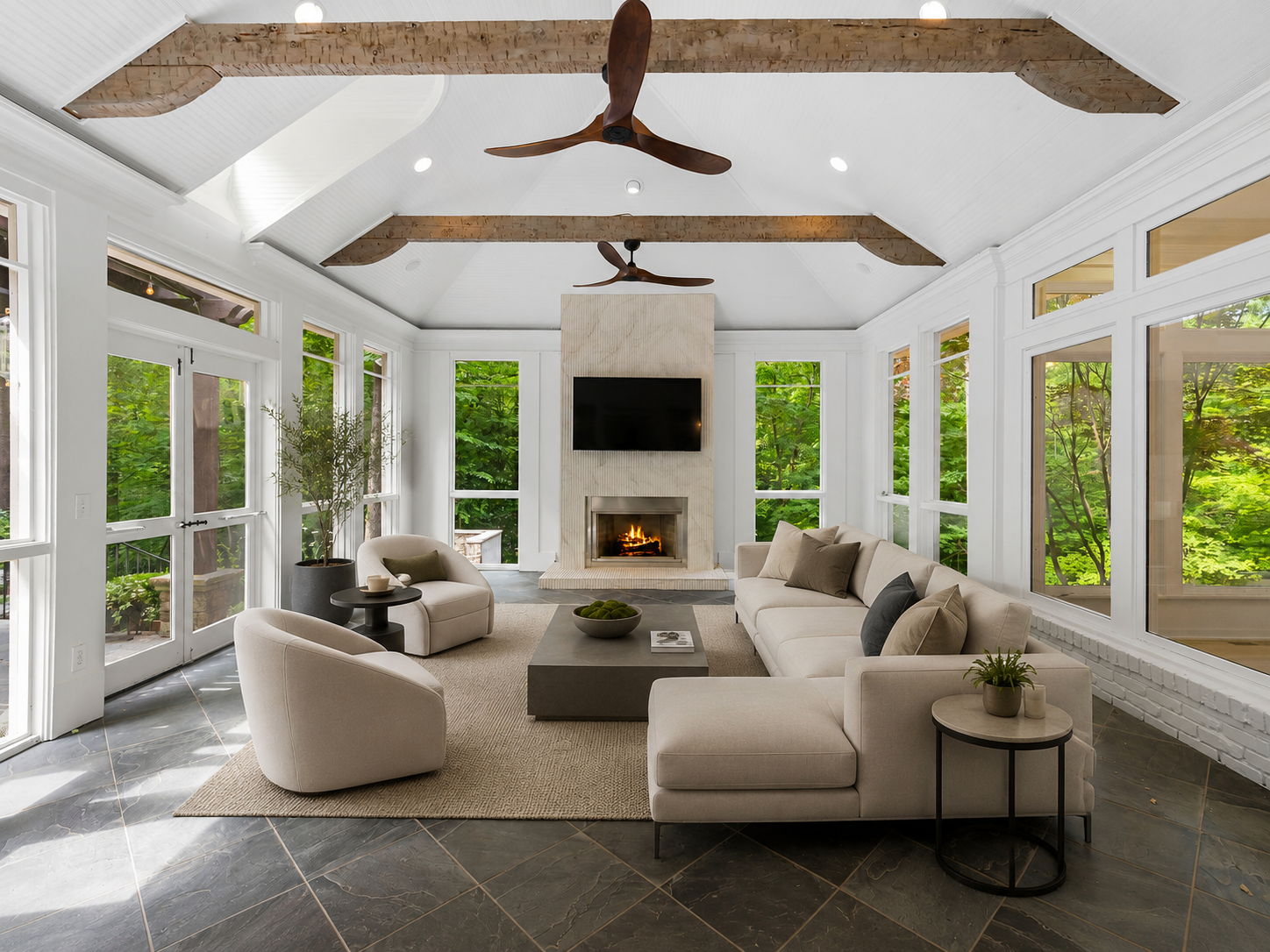 Screened porch with fireplace. Virtually staged