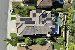 Aerial View of home paid off solar panels pool and spa